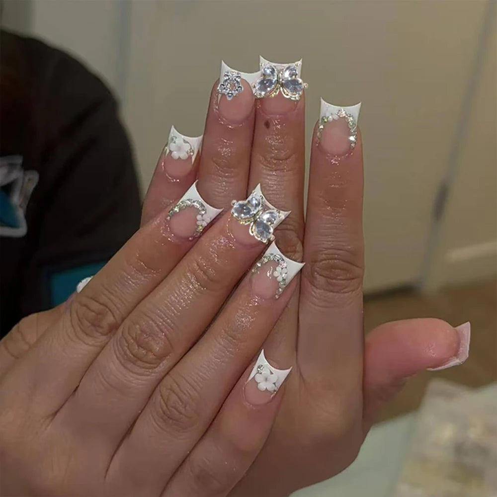 Duck Nail French Tips with Cross, Snake & Rhinestone Design.