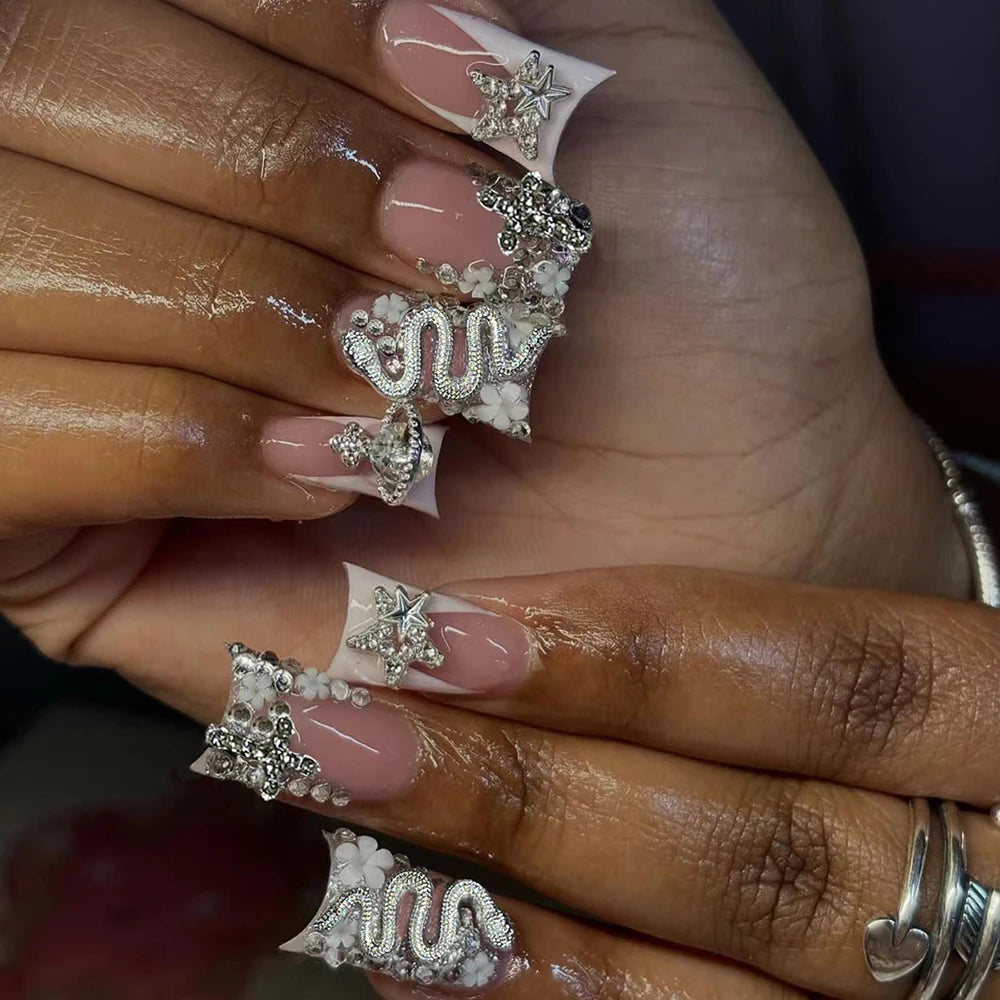 Duck Nail French Tips with Cross, Snake & Rhinestone Design.